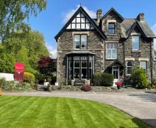 An exterior view of the property frontage, a traditional Lakeland stone built accommodation, the five-star Beaumont House - Adults Only.