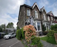 A external view of the stone faced traditional Lakeland property of the four-star Brook House  Bed and breakfast in Windermere Lake District.