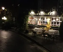 A nighttime, external view of the Churchills Inn & Rooms in Bowness-on-Windermere
