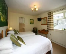 View of a bedroom in the 3 star Claremont House Ambleside.
