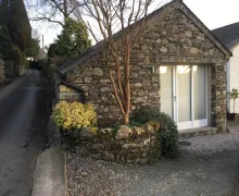 A image of the  stone built three-star Lowghyll Suite in Bowness-on-Windermere, Lake District