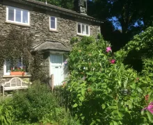 A view of the 4 star Stockghyll Cottage and garden in Bowness-on-Windermere.