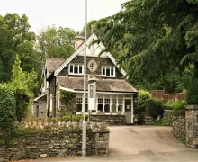 A charming exterior view of the distinctive Lakeland stone, four star 'The Coach House'   near Windermere in the Lake District