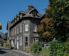 An external view of Wanslea Guest House Ambleside. A traditional Lakeland stone faced property.