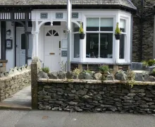 An exterior view of the four-star White Rose guest house in Windermere, Lake District