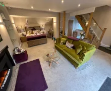An interior view of a bedroom and lounge suite at the Windermere Boutique Hotel & Spa near Windermere in the Lake District
