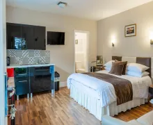 An image an en-suite bedroom  and a mini  kitchen at the Windermere Studio Rooms near Windermere in the Lake District