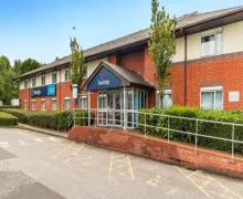 An external view of the Travelodge Manchester Birch M62 Westbound